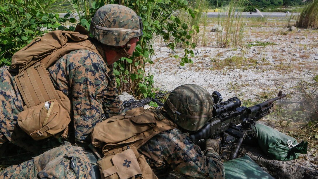 U.S. Marine Cpl. Ryan Downy, a machine gunner with Battalion Landing Team 2nd Battalion, 5th Marines, 31st Marine Expeditionary Unit, fires his M240 medium machine gun during live-fire training with Philippine Marines at Crow Valley, Philippines, Oct. 6, 2015. Philippine Marines with 31st Marine Company, Marine Battalion Landing Team 1, Armed Forces of the Philippines and the U.S. Marines with BLT 2/5, 31st MEU, are training side by side as part of Amphibious Landing Exercise 2015, an annual bilateral training exercise conducted by members of the Armed Forces of the Philippines alongside U.S. Marine and Navy Forces. 
