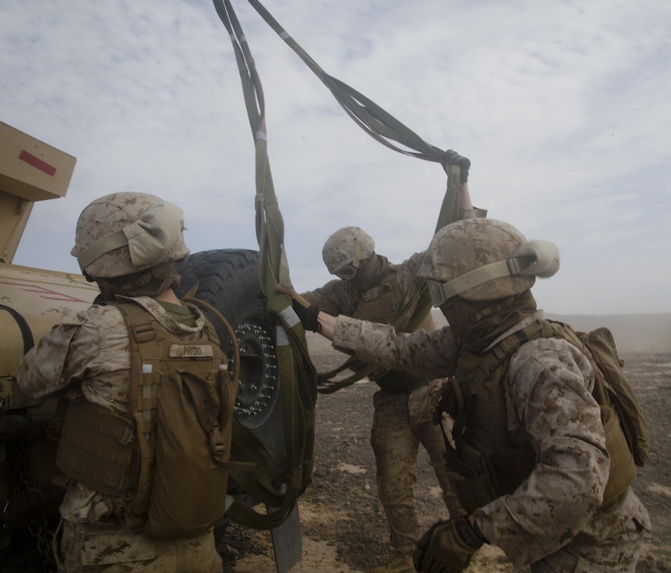 Marines prepare a Humvee for transport via a CH-53E Super Stallion helicopter during an assault support tactics exercise at Landing Zone Bull, Chocolate Mountain Aerial Gunnery Range, Calif., Oct. 12, 2015. U.S. Marine Corps photo by Cpl. Summer Dowding      