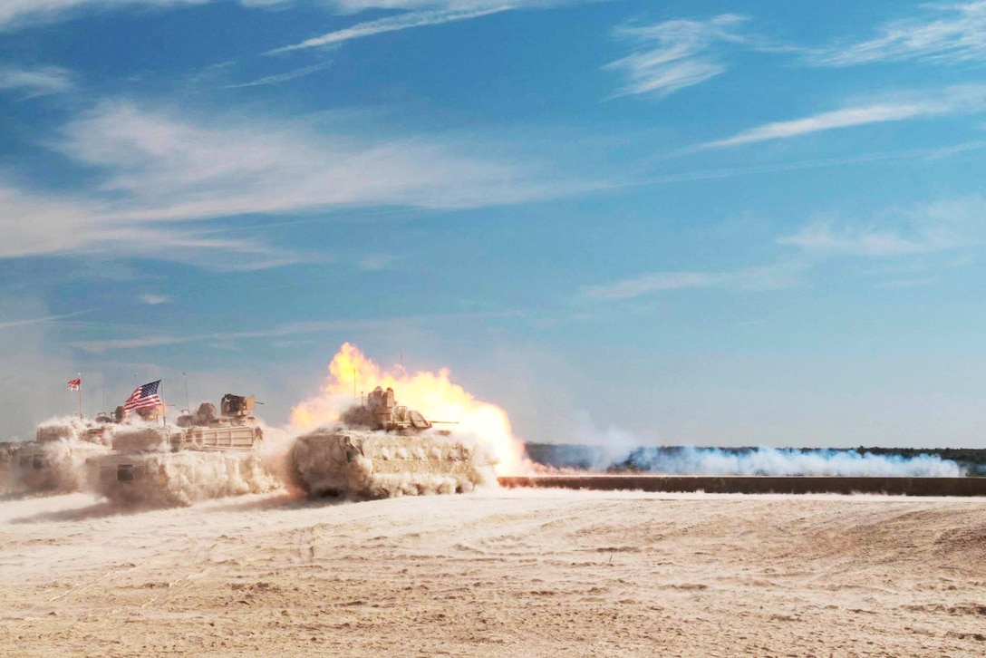 Soldiers conduct a live-fire demonstration with M1A2 Abrams tanks and an M2A3 Bradley Fighting Vehicle on Fort Hood, Texas, Oct. 17, 2015. The soldiers are assigned to 3rd Brigade Combat Team, 1st Cavalry Division. U.S. Army photo by Sgt. Brandon Banzhaf