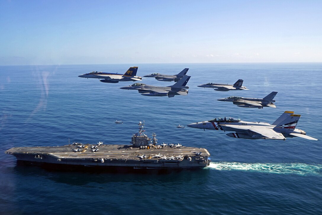 U.S. Navy and Chilean Air Force aircraft participate in a fly-by adjacent to the aircraft carrier USS George Washington during Exercise UNITAS 2105 in the Pacific Ocean, Oct. 20, 2015. UNITAS 2015 is the U.S. Navy's longest running annual multinational maritime exercise, and is part of Southern Seas 2015. U.S. Navy photo by Lt. j.g. David Babka
