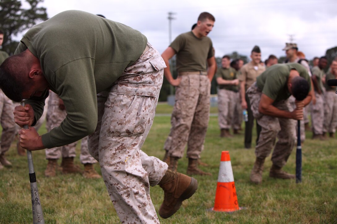 Marines with Headquarters and Headquarters Squadron and Marine Wing Headquarters Squadron 2 compete in the “Dizzy Izzy” during the bi-annual field meet at Marine Corps Air Station Cherry Point, N.C., May 22, 2015. Marines with H&HS and MWHS-2 went head-to-head in a tug-of-war, a 7-ton pull, relay races and other events to build teamwork and camaraderie.