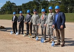 Dignitaries ready their shovels at a ground-breaking ceremony for the new Defense Logistics Agency Aviation Operations Center held Oct. 15, 2015 on Defense Supply Center Richmond, Virginia.  Pictured from back to front, David Gibson, DLA Installation support at Richmond site director; Elaine Lee, president of the Bellwood Women’s Club; representing Congressman Randy Forbes’ Office, District Director, Western Region and District Military Liaison Ronald White; Defense Logistics Agency Aviation Commander Air Force Brig. Gen. Allan Day; Chesterfield County Administrator James Stegmaier; U.S. Army Corps of Engineers, Norflok District Deputy Commander Lt. Col. John Drew, and Hensel Phelps Construction Representative Bill Thumm.