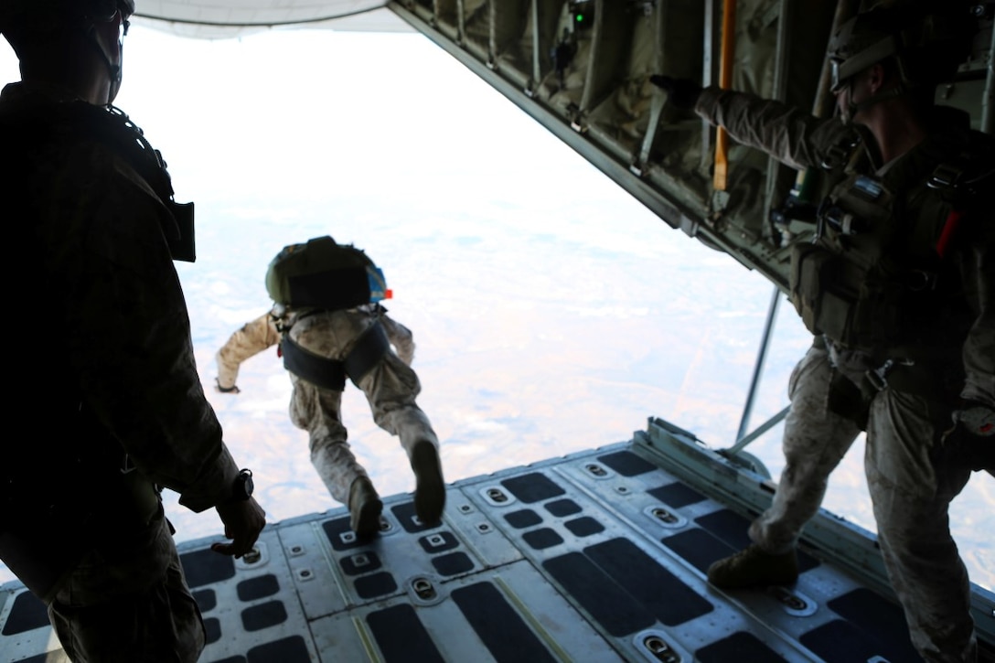 Marines with 1st Reconnaissance Battalion, 1st Marine Division conduct free fall jump training from a C-130 Hercules with 3rd Marine Aircraft Wing aboard Marine Corps Base Camp Pendleton, Calif., Oct. 16, 2015. 1st Recon conducted parachute operations in preparation for future deployments. (U.S. Marine Corps photo by Cpl. Demetrius Morgan/RELEASED)