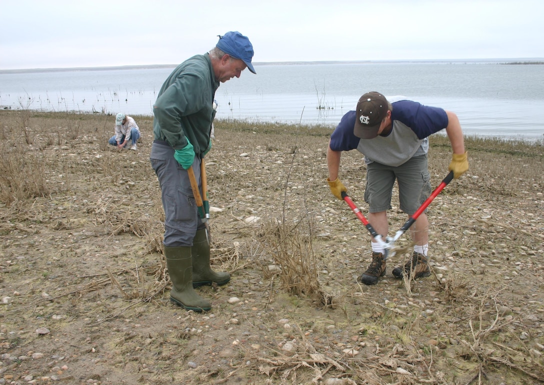 JOHN MARTIN RESERVOIR, Colo. -- Volunteers prepare the potential nesting areas for two threatened and endangered species, Saturday, Sept. 26, 2015. 