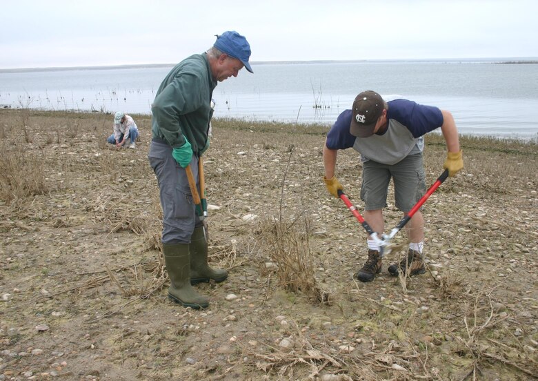 JOHN MARTIN RESERVOIR, Colo. -- Volunteers prepare the potential nesting areas for two threatened and endangered species, Saturday, Sept. 26, 2015. 