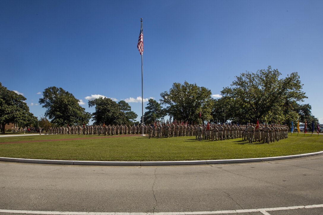 Marines and sailors with II Marine Expeditionary Force Headquarters Group, 2nd Marine Division, 2nd Marine Aircraft Wing, 2nd Marine Logistics Group, 22nd Marine Expeditionary Unit and 24th Marine Expeditionary Unit stand in formation during a change of command ceremony at Camp Lejeune, N.C., Oct. 22, 2015. During the ceremony, Maj. Gen. Walter L. Miller Jr., commanding general of II MEF, assumed command of II MEF from Maj. Gen. William D. Beydler.