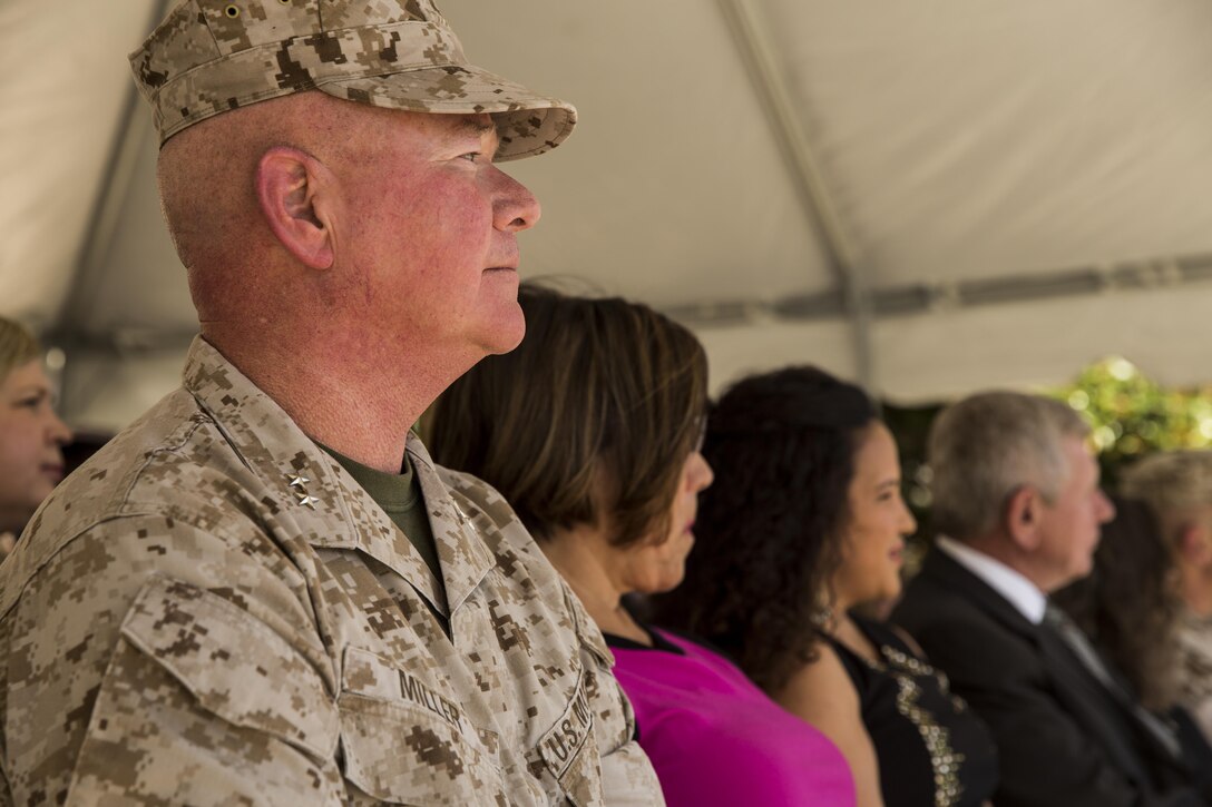 Maj. Gen. Walter L. Miller Jr., commanding general of II Marine Expeditionary Force, observes as the 2nd Marine Division band plays during a change of command ceremony in which Miller assumed command from Maj. Gen. William D. Beydler at Camp Lejeune, N.C., Oct. 22, 2015. Beydler took command of II MEF in July of 2014 and immediately focused his attention on II MEF readiness to deploy, employ and redeploy forces in support of Geographic Combatant Commander requirements and the National Security Strategy. His force preservation and community outreach initiatives such as the new “Protect What You’ve Earned” campaign were designed to keep Marines prepared for the mission.