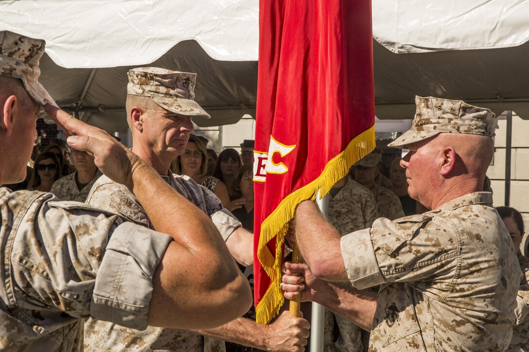 Maj. Gen. Walter L. Miller Jr. (right), commanding general of II Marine Expeditionary Force, receives the II MEF colors from Maj. Gen. William D. Beydler, former commanding general, during a change of command ceremony at Camp Lejeune, N.C., Oct. 22, 2015. Beydler, currently nominated for his third star, will become the new commanding general of Marine Corps Forces Central Command (MARCENT) based out of Tampa, Florida.