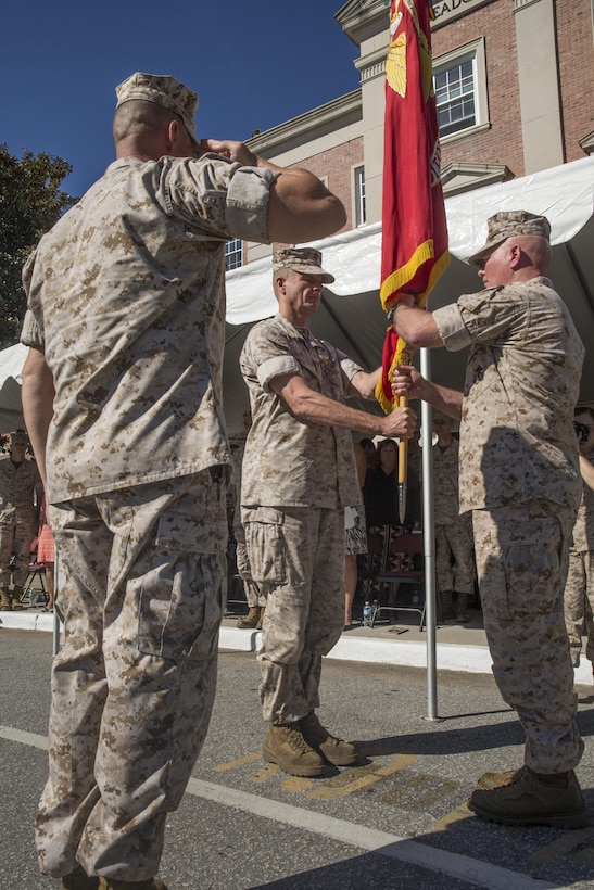 Maj. Gen. Walter L. Miller Jr. (right), commanding general of II Marine Expeditionary Force, receives the II MEF colors from Maj. Gen. William D. Beydler, former commanding general, during a change of command ceremony at Camp Lejeune, N.C., Oct. 22, 2015. Miller, who arrived at II MEF following a stint as Chief of Staff for U.S. Special Operations Command, said returning to command II MEF forces provides him the opportunity to expand on his predecessor’s success in preparing the unit to defend the nation as an elite fighting force.