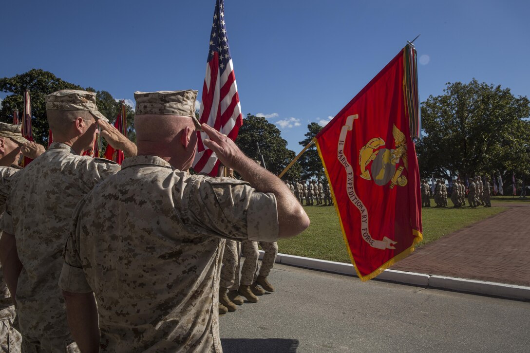 Gen. John M. Paxton (far left), Assistant Commandant of the Marine Corps, Maj. Gen. William D. Beydler (middle), former commanding general of II Marine Expeditionary Force, and Maj. Gen. Walter L. Miller Jr., commanding general of II MEF, salute the II MEF colors during a change of command ceremony at Camp Lejeune, N.C., Oct. 22, 2015. During the ceremony, Miller assumed command from Beydler. Miller plans to continue support for operations and exercises that range from expeditionary to amphibious in nature. Marines and sailors of II MEF will employ for humanitarian assistance, disaster relief, crisis and contingency response, theater security cooperation, and serve as a credible deterrent force for the United States of America.