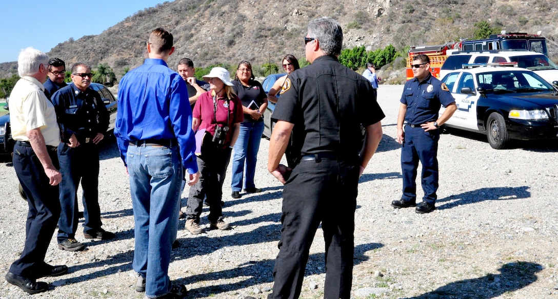 Members from U.S. Army Corps of Engineers Los Angeles District, U.S. Fish and Wildlife Service, Congresswoman Napolitano’s Office, Los Angeles County Fire Department, Azuza Police Department and the City of Duarte discuss the problems in cleaning up the San Gabriel River near Sana Fe Dam Oct. 21.