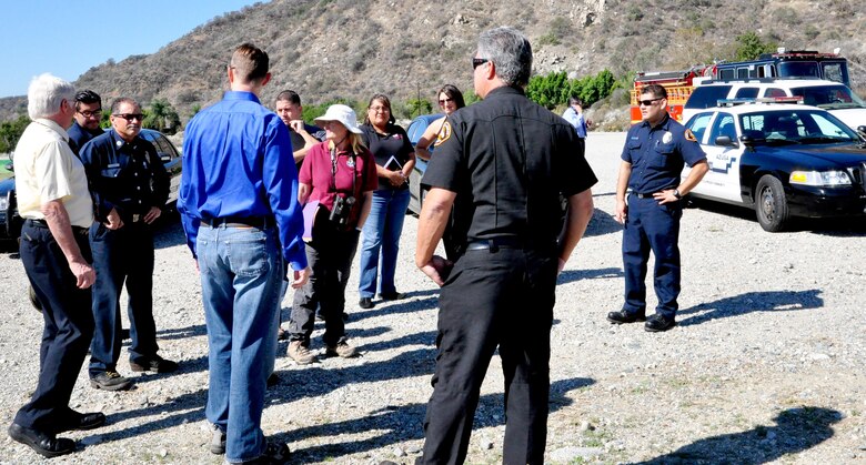 Members from U.S. Army Corps of Engineers Los Angeles District, U.S. Fish and Wildlife Service, Congresswoman Napolitano’s Office, Los Angeles County Fire Department, Azuza Police Department and the City of Duarte discuss the problems in cleaning up the San Gabriel River near Sana Fe Dam Oct. 21.