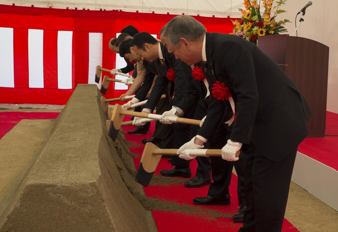 Japanese dignitaries break the dirt at the Atagoyama Baseball Field ground breaking ceremony in Iwakuni City, Japan, Oct. 15, 2015. Atagoyama Baseball Field is thanks to the city for their understanding and cooperation in the continuing support of the presence and operations of the U.S. military installation. 