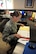 Senior Airman Monica Casanova, 56th Operations Support Squadron airfield management shift lead, references a check-list at the Luke Air Force Base airfield management office Oct 13 2015. (U.S. Air Force photo by Staff Sgt. Staci Miller)
