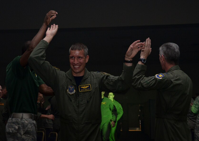 Capt. Dustin Faircloth, 2nd Operations Support Squadron instructor pilot, runs down the aisle before the Global Strike Challenge score posting at Barksdale Air Force Base, La., Oct. 21, 2015. Since establishment in 2010, the competition promotes esprit de corps, boosting Airmen’s confidence and showcasing the abilities of their installations. (U.S. Air Force photo/Senior Airman Amanda Morris)