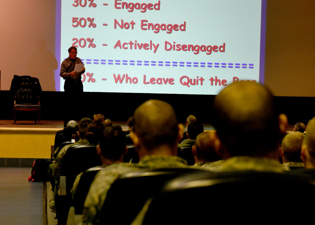 Jim Hunter, author and public speaker, provides statistics to the audience during a servant leadership seminar, Oct. 20, 2015, at Aviano Air Base, Italy. Topics during the seminars included the qualities that make up a servant leader and how all Airmen can develop their leadership style. (U.S. Air Force photo by Airman 1st Cary Smith/Released)
