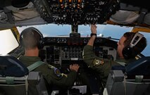U.S. Air Force Capt. RJ Allen, left, 351st Air Refueling Squadron pilot, and U.S. Air Force Maj. Joseph Smith, 351st ARS instructor pilot, fly to Son San Juan Air Base, Spain for Exercise Trident Juncture Oct. 20, 2015, over England. The exercise will primarily be conducted in Spain, Portugal and Italy with additional activities in Belgium, Canada, Germany, the Netherlands, Norway and at sea in the Atlantic Ocean and Mediterranean Sea. (U.S. Air Force photo by Senior Airman Christine Halan/Released)