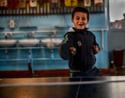 A Moldovan student plays ping-pong Oct. 19, 2015, at Liceul Teoretic Alexei Mateevici School, Sanatauca, Moldova. Approximately seven Airmen from the 435th Construction and Training Squadron and the 52nd Civil Engineer Squadron worked on the renovations since Sept. 23. The renovations were part of the Moldova Humanitarian and Civic Assistance program is part of a military and civilian theater security cooperation program the U.S. European Command uses to directly impact civilian communities throughout 17 countries, primarily in Eastern Europe. (U.S. Air Force photo/Senior Airman Nicole Sikorski)