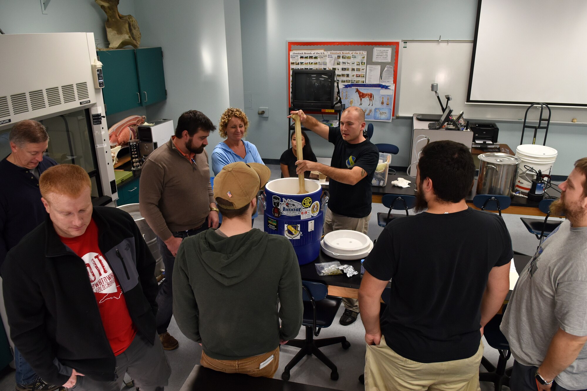 First Lt. Ryan DeLine, 4th Equipment Maintenance Squadron maintenance flight commander, demonstrates how to brew an all-grain beer during a brewing workshop, Oct. 17, 2015, at Wayne Community College in Goldsboro, North Carolina. DeLine is one of the founding members of the Seymour Johnson Home Brew Club. (U.S. Air Force photo/Senior Airman Aaron J. Jenne)