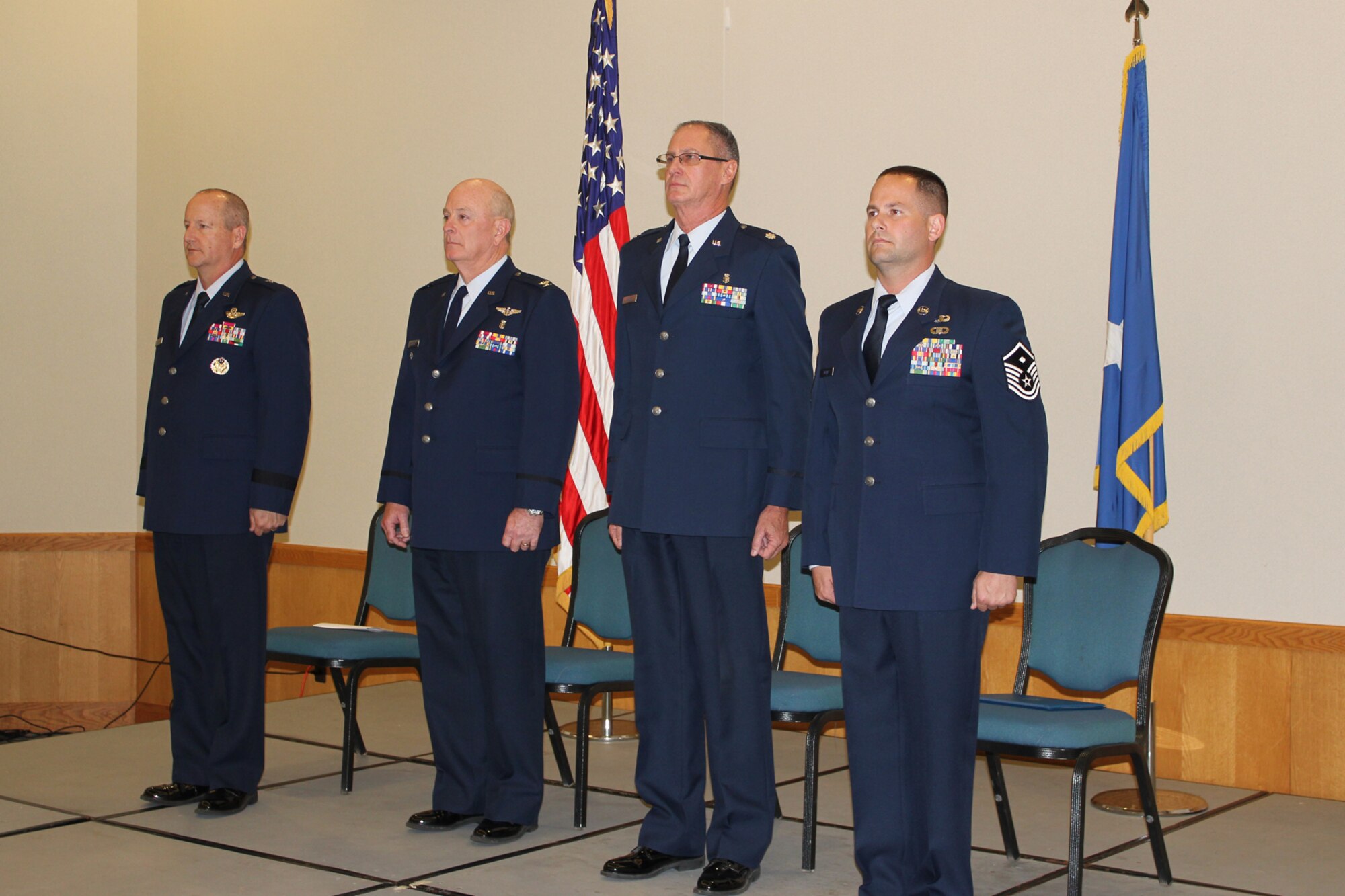 From left to right:  Brig. Gen. John Slocum, 127th Wing commander, Col. Sidney Martin, Michigan Air National Guard Air Surgeon, Col. Mark Manor, 127th Medical Group commander, and Master Sgt. Lyle Black, 127th Medical Group first sergeant all prepare for the transfer of command ceremony for the 127th Wing Medical Group at Selfridge Air National Guard Base, Michigan, October 18, 2015. (U.S. Air National Guard photo by TSgt. Dan Heaton/released)