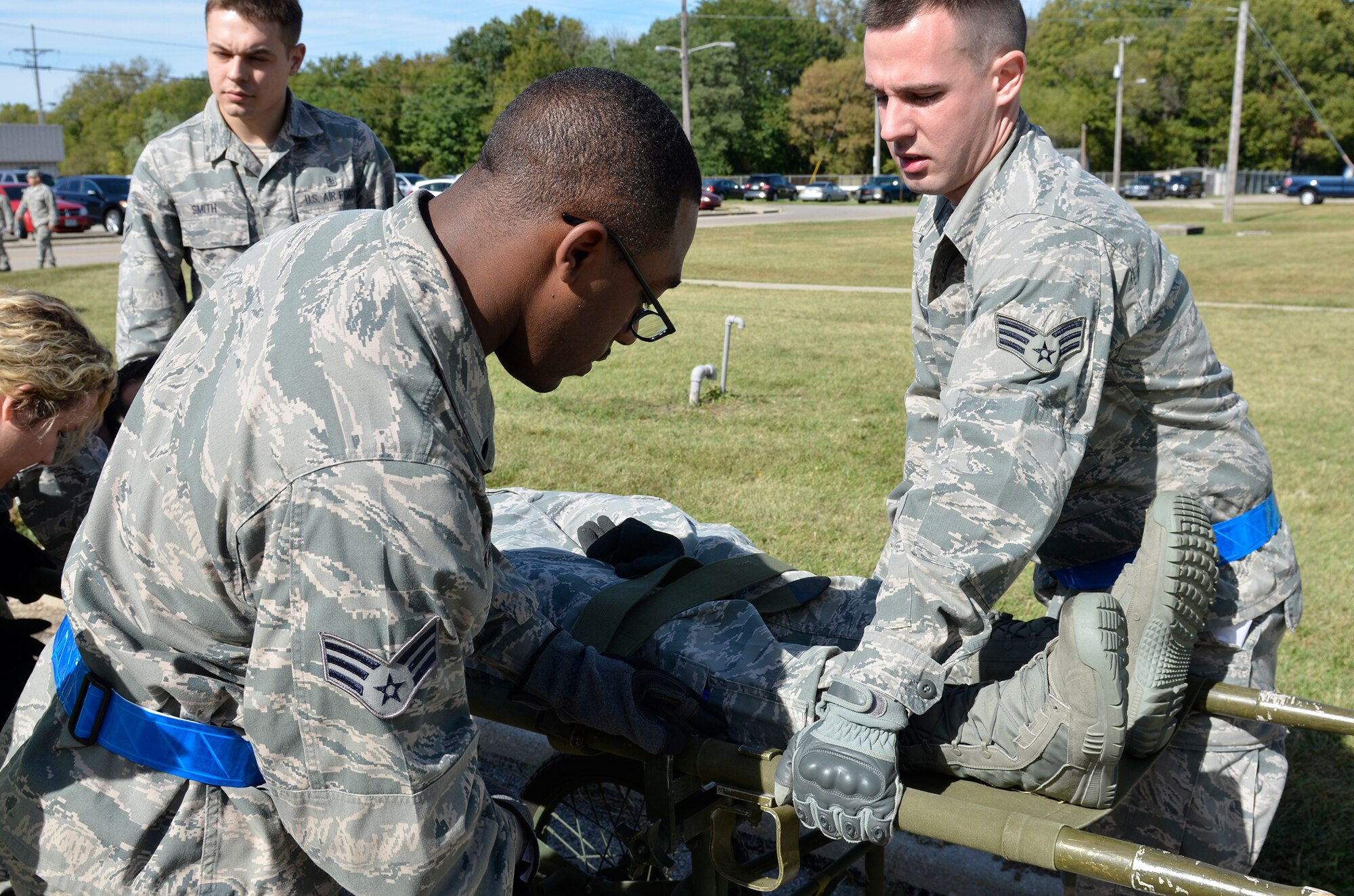 WRIGHT-PATTERSON AIR FORCE BASE, Ohio – 445th Aeromedical Staging Squadron medical technicians evacuate a patient to a shelter during the ASTS “Victory or Death – Heal and Defend” exercise Oct. 4, 2015. Approximately 70 Airmen participated in the 24-event exercise designed to accomplish annual and quarterly mandatory and ancillary training. (U.S. Air Force photo/Senior Airman Joel McCullough)