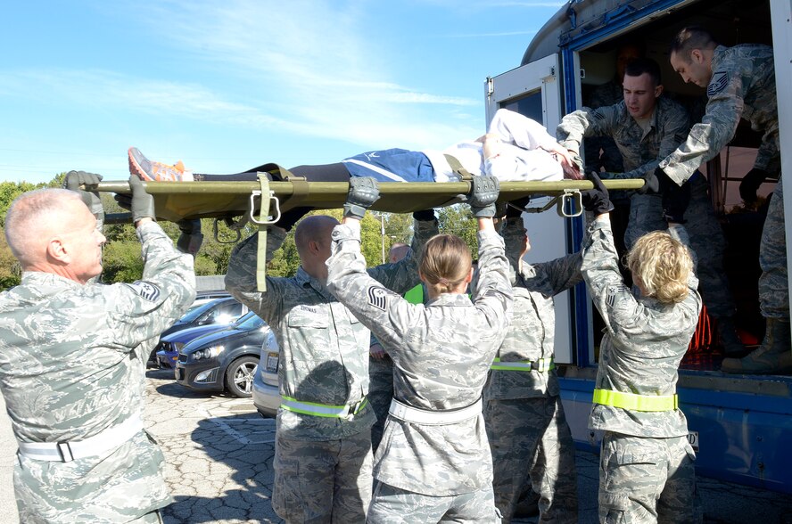 WRIGHT-PATTERSON AIR FORCE BASE, Ohio – Reservists assigned to the 445th Aeromedical Staging Squadron prepare to transport a patient to the flight line for a simulated medical evacuation during the ASTS “Victory or Death – Heal and Defend” exercise Oct. 4, 2015. Approximately 70 Airmen participated in the 24-event exercise designed to accomplish annual and quarterly mandatory and ancillary training. (U.S. Air Force photo/Senior Airman Joel McCullough)