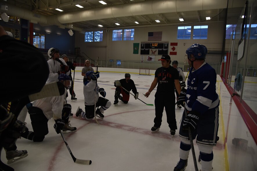 Eastern Washington University student James Warden, Fairchild Falcons head coach briefs the team during practice Sept. 30, 2015, at Eastern Washington University, Wash. As a sophomore, he was offered the position of assistant coach from a teammate, who at the time was the Falcon’s head coach. Warden accepted the position and has now been working with the Falcons for more than two years. (U.S. Air Force photo/Airman 1st Class Sean Campbell)