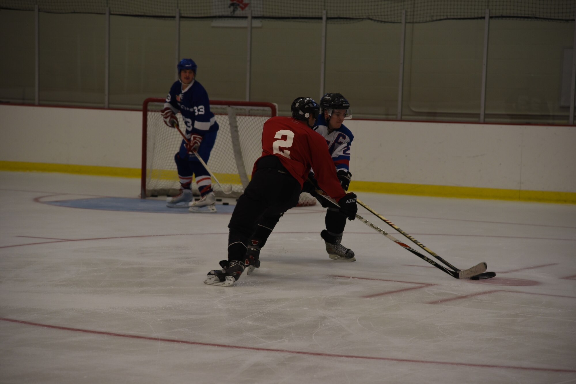 Airman 1st Class Alexander Yount, 93rd Air Refueling Squadron boom operator and Airman Keahi Johnson, 92nd Aircraft Maintenance Squadron aerospace maintenance apprentice compete for the puck during a scrimmage Sept. 30, 2015, at Eastern Washington University, Wash. The Fairchild Falcons conduct practices at the EWU athletic complex. (U.S. Air Force photo/Airman 1st Class Sean Campbell))