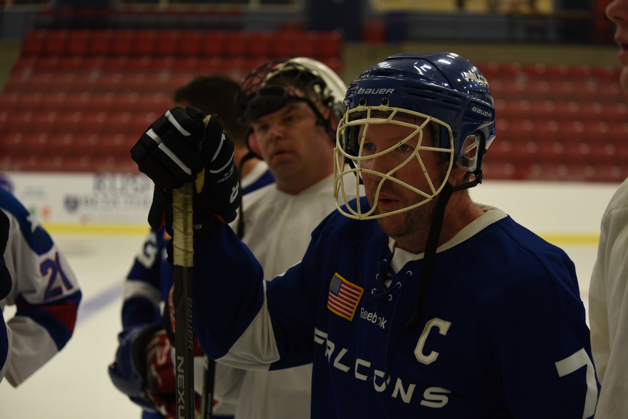 Retired Lt. Col. Adam Marshal listens to a briefing at practice Sept. 30, 2015, at Eastern Washington University, Wash. The Fairchild Falcons draw players from active duty, guard, civilians, retirees and dependents to create a fully integrated team. (U.S. Air Force photo/Airman Class 1st Sean Campbell)