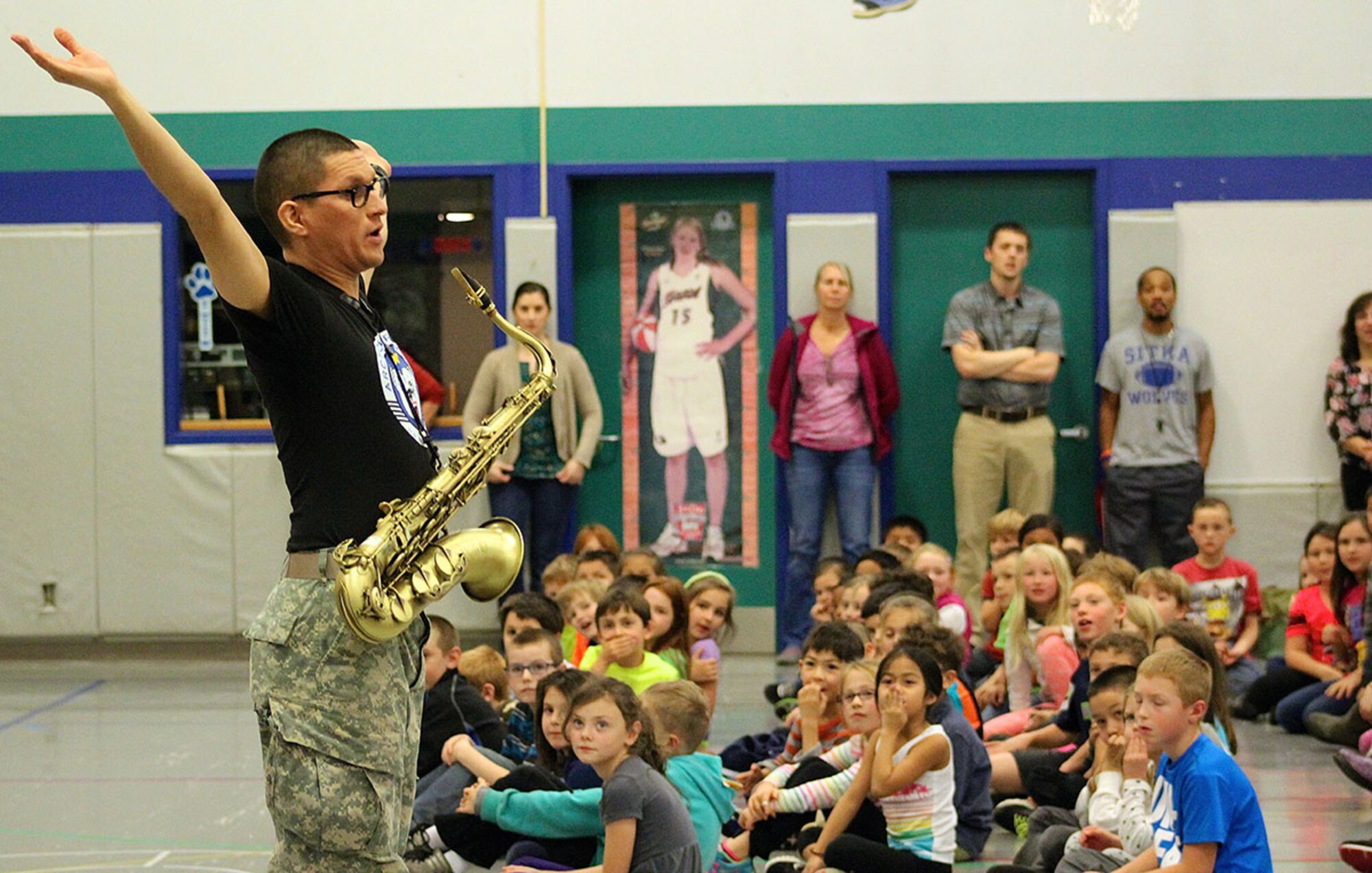 Spc. Charles Moncayo with the 9th Army Band captures the attention of Keet Gooshi Elementary School students Oct. 14 during an educational concert in Sitka. This is the first time in about 10 years the Fort Wainwright Soldiers have performed in area schools in addition to their annual participation in the town’s Alaska Day Festival. (U.S. Army photo/Mary M. Rall)