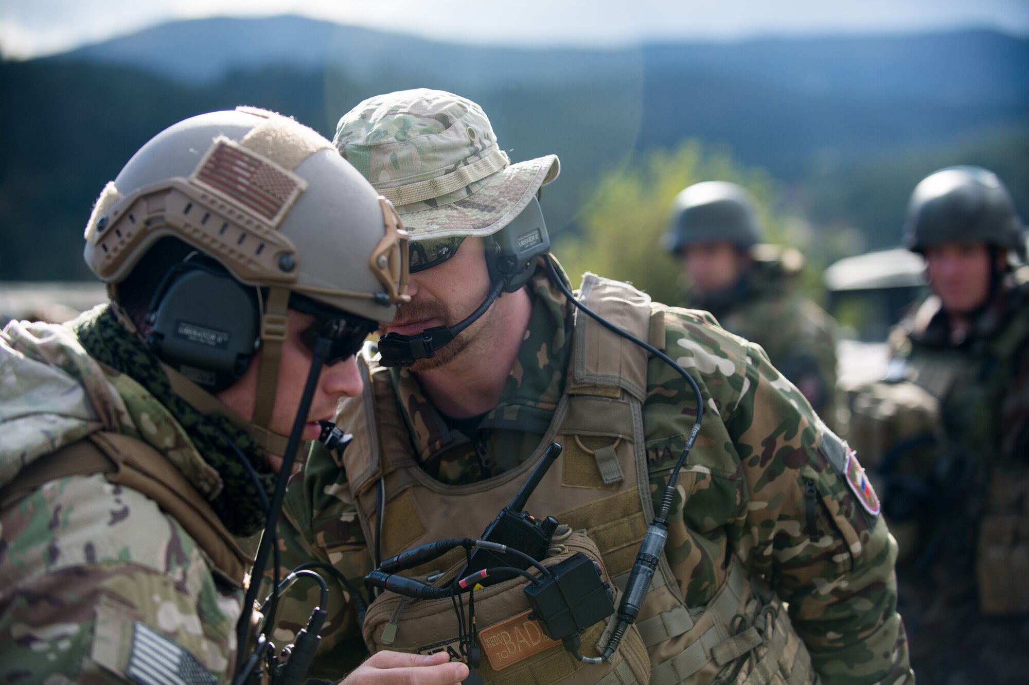 A Slovenian air force joint terminal attack controller, speaks with U.S. Air Force Senior Airman Brian Smith, 2nd Air Support Operations Squadron JTAC, after providing close air support during exercise Rock Proof V Oct. 16, 2015, at Pocek Training Range, near Postojna, Slovenia,. JTACs provide accurate, timely and relevant environmental situational awareness for units across a variety of operations. (U.S. Air Force photo/Staff Sgt. Armando A. Schwier-Morales)