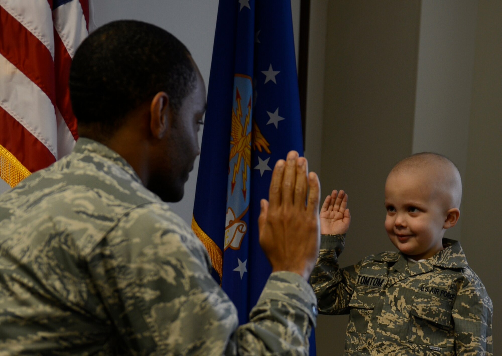 Tom Tom Echelmeyer, just 4 years old, was an Airman for a Day in March 2014 after going through treatment for leukemia. For his father, Tech. Sgt. Thomas Echelmeyer, 21st Aerospace Medicine Squadron bioenvironmental engineering flight NCO in charge, and their family, the event demonstrated how the support of fellow Airman can make tough times a little less stressful. (courtesy photo)