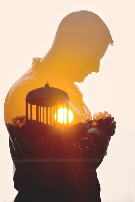 Master Sgt. Jermey Lawley, 11th Wing Equal Opportunity superintendent, and the sunset over Joint Base Andrews, Md., in a double exposure photograph to represent the spiritual fitness pillar of Comprehensive Airmen Fitness. (U.S. Air Force graphic by Airman 1st Class Philip Bryant/Released)