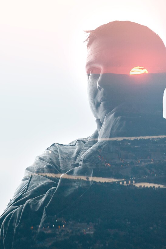 Master Sgt. Jermey Lawley, 11th Wing Equal Opportunity superintendent, and a sunset over Virginia in a double exposure photograph to represent the mental fitness pillar of Comprehensive Airmen Fitness. (U.S. Air Force graphic by Airman 1st Class Philip Bryant/Released)