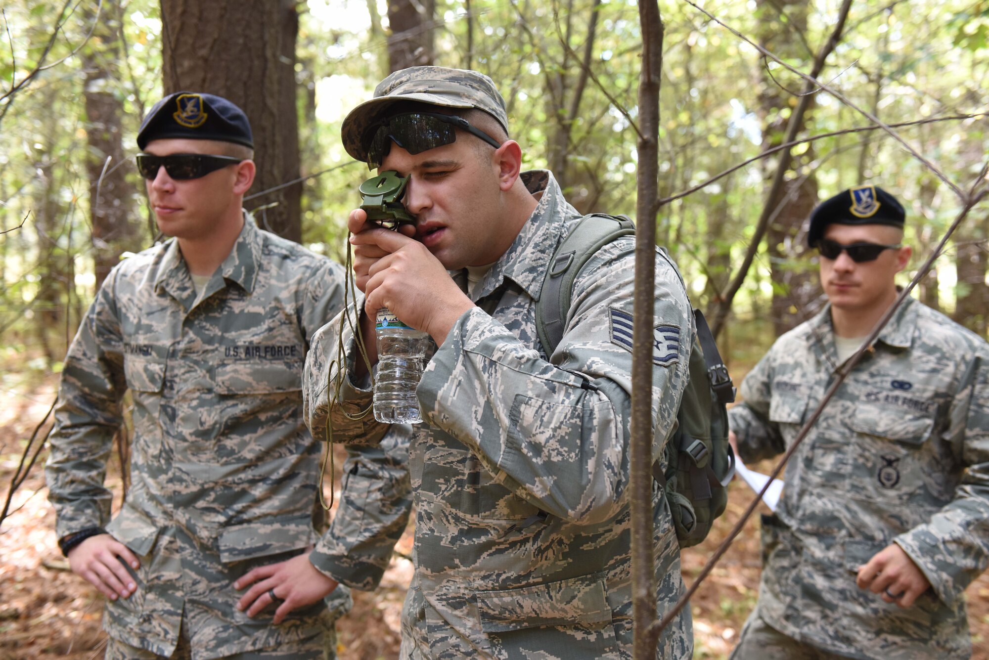 Ohio Air National Guard Staff Sgt. Kyle Meyer, security forces journeyman at the 180th Fighter Wing, operates a compass to determine the direction he and his fellow Airmen need to walk to successfully navigate a training course set up in the Oak Openings Metro Park in Swanton, Ohio, Sep. 27, 2015. Oak Openings provides a real-world terrain for Airmen using traditional navigational tools to conduct their annual training by maneuvering their way through the park’s sand dunes and wetlands. (Ohio Air National Guard photo by Tech. Sgt. Nic Kuetemeyer)