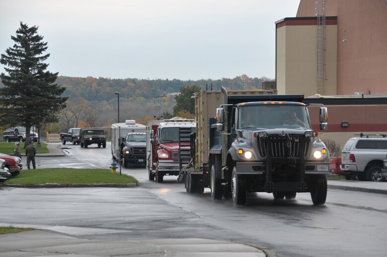 The 109th Fire Department's urban search and rescue team and 109th Vehicle Maintenance Flight return to Stratton Air National Guard Base on Oct. 22, 2015, from Camp Smith, New York, where they met up with the 106th Rescue Wing and 105th Airlift Wing to conduct a three-day joint search and rescue training exercise. The 109th USAR team, the lead within the New York Air National Guard, is currently the only self-sufficient fully capable mobile unit in the Air National Guard. (U.S. Air National Guard photo by Master Sgt. William Gizara/Released)