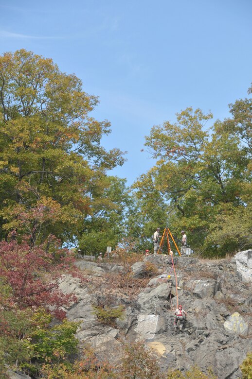 The New York Air National Guard's 109th and 106th Fire Departments' urban search and rescue teams complete high angle training during a joint search and rescue training exercise Oct. 21, 2015 at Camp Smith, New York. The 109th USAR team, the lead within the New York Air National Guard, is currently the only self-sufficient fully capable mobile unit in the Air National Guard. (U.S. Air National Guard photo by Tech. Sgt. Catharine Schmidt/Released)