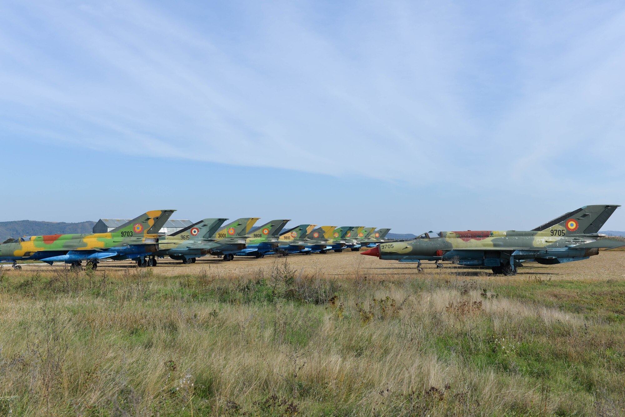 Romanian MiG-21 Lancers sit lined up near the airfield at Campia Turzii, Romania during the exercise Dacian Viper DV day, Oct. 16, 2015. Romania will soon be replacing its fleet of MiG-21 fighters with F-16 Fighting Falcons. Exercise Dacian Viper is a flying training deployment between the Alabama Air National Guard and Romanian Air Force designed to increase readiness to conduct combined air operations and to meet future security challenges. (U.S. Air Force photo byCapt. Lauren Ott/Released)