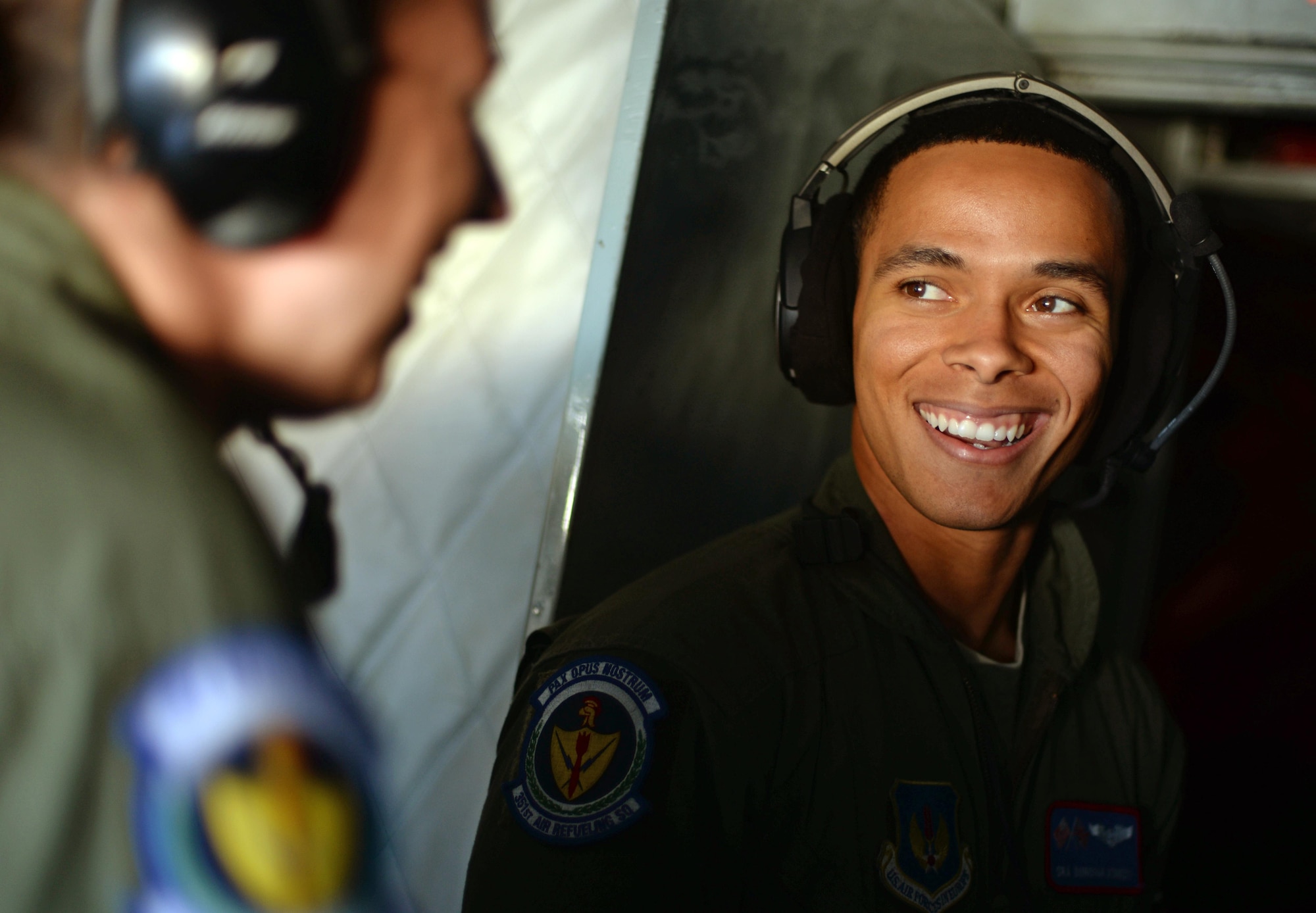 U.S. Air Force Senior Airman Donovan Kennedy, 351st Air Refueling Squadron boom operator, speaks with U.S. Air Force Senior Airman Danielle Repp, 351st ARS boom operator, Oct. 21, 2015, over England. Airmen with the 100th Air Refueling Wing will participate in Trident Juncture from October through early November 2015.  (U.S. Air Force photo by Senior Airman Christine Halan/Released)