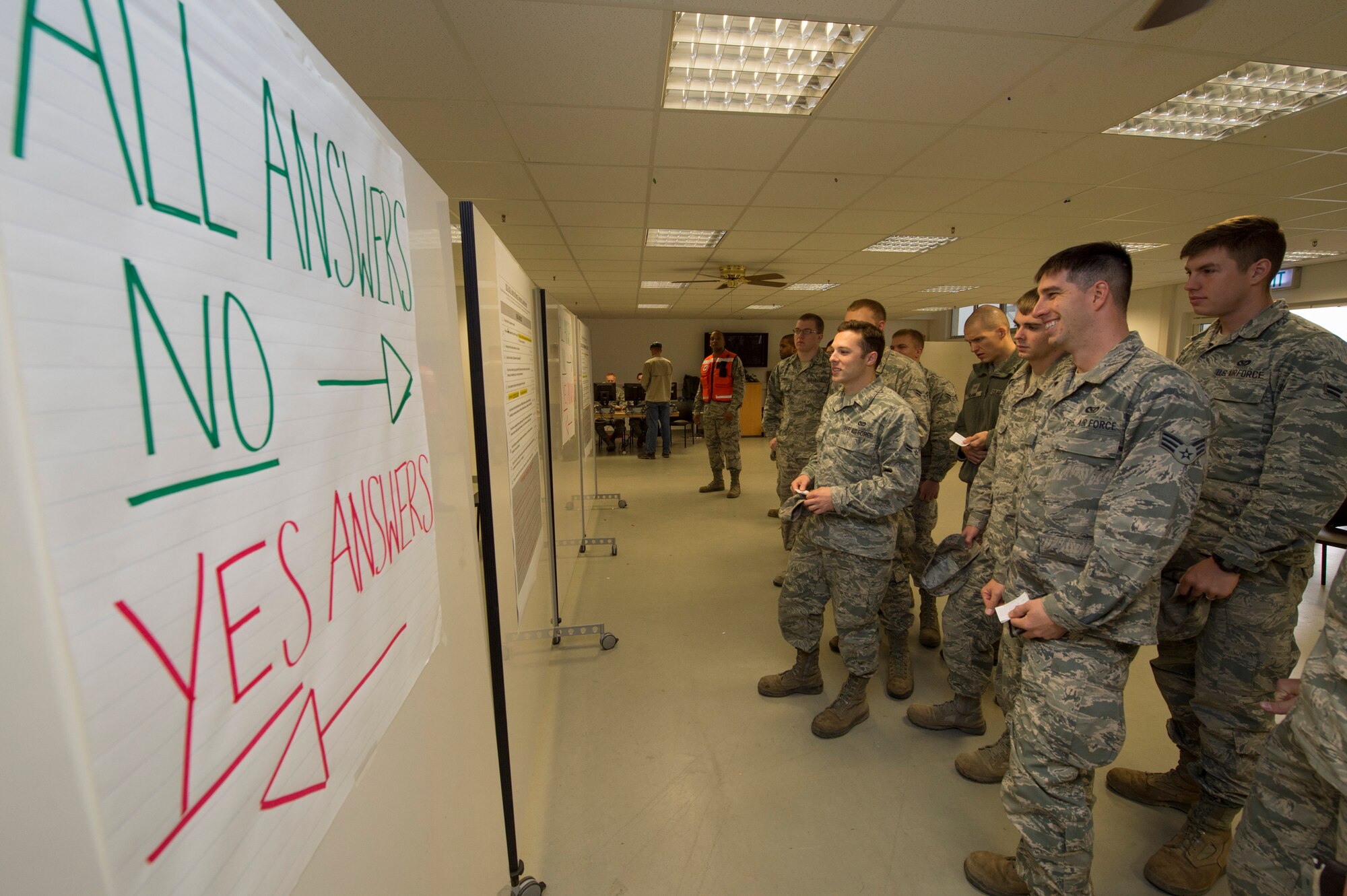 Airmen review a medical questionnaire before receiving their influenza vaccine during a disease containment plan exercise Oct. 21, 2015, at Spangdahlem Air Base, Germany. Some of the common side effects from the mist include runny nose or nasal congestion, fever, sore throat, cough and aches. (U.S. Air Force photo by Staff Sgt. Christopher Ruano/Released)