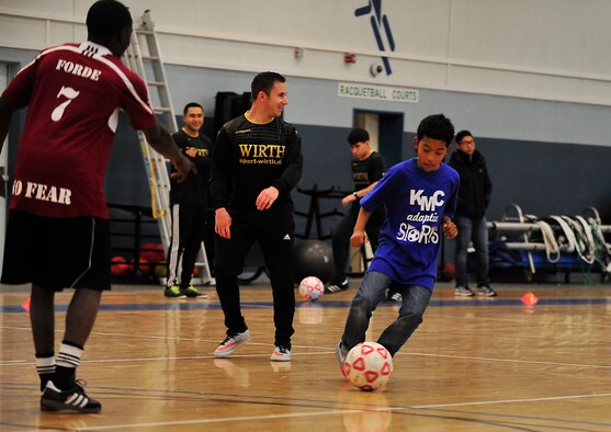 Elijah Muhammad, Ramstein Middle School student, dribbles the ball toward a goal during the Kaiserslautern Military Community Adaptive Sports soccer event Oct. 15, 2015, at Vogelweh Military Complex, Germany. Special needs students from Ramstein and Vogelweh Middle and High Schools had the opportunity to play soccer against each other and build camaraderie. (U.S. Air Force photo/Airman 1st Class Larissa Greatwood)