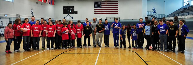 Students from Ramstein and Vogelweh Middle and High Schools pose for a group photo after participating in the Kaiserslautern Military Community Adaptive Sports soccer event Oct. 15, 2015, at Vogelweh Military Complex, Germany. The students had the opportunity to meet students from the other schools, play soccer and enjoy a barbecue together. (U.S. Air Force photo/Airman 1st Class Larissa Greatwood)