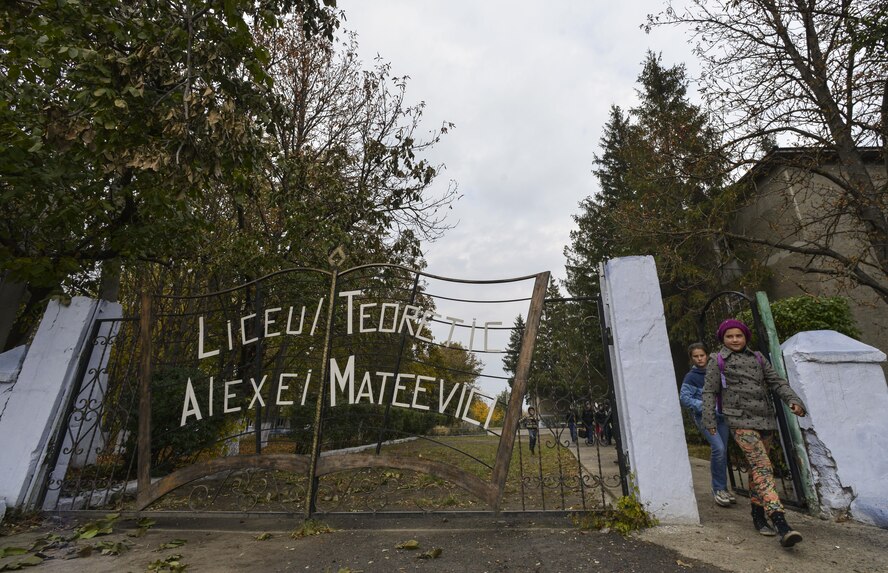 Moldovan students leave Liceul Teoretic Alexei Mateevici School for the day Oct. 19, 2015, in Sanatauca, Moldova.   Approximately seven Airmen from the 435th Construction and Training Squadron and the 52nd Civil Engineer Squadron have been working on renovations to a gymnasium locker room at Liceul Teoretic Alexei Mateevici School, in Sanatauca, since Sept. 23. The Moldova Humanitarian and Civic Assistance program is part of a military and civilian theater security cooperation program the U.S. European Command uses to directly impact civilian communities throughout 17 countries, primarily in Eastern Europe. As well as allowing service members the opportunity to further their skillsets on the construction site, HCA projects also promote increased bonds and trust for future operations and improvement between the U.S. and partnered nations. (U.S. Air Force photo/Senior Airman Nicole Sikorski)