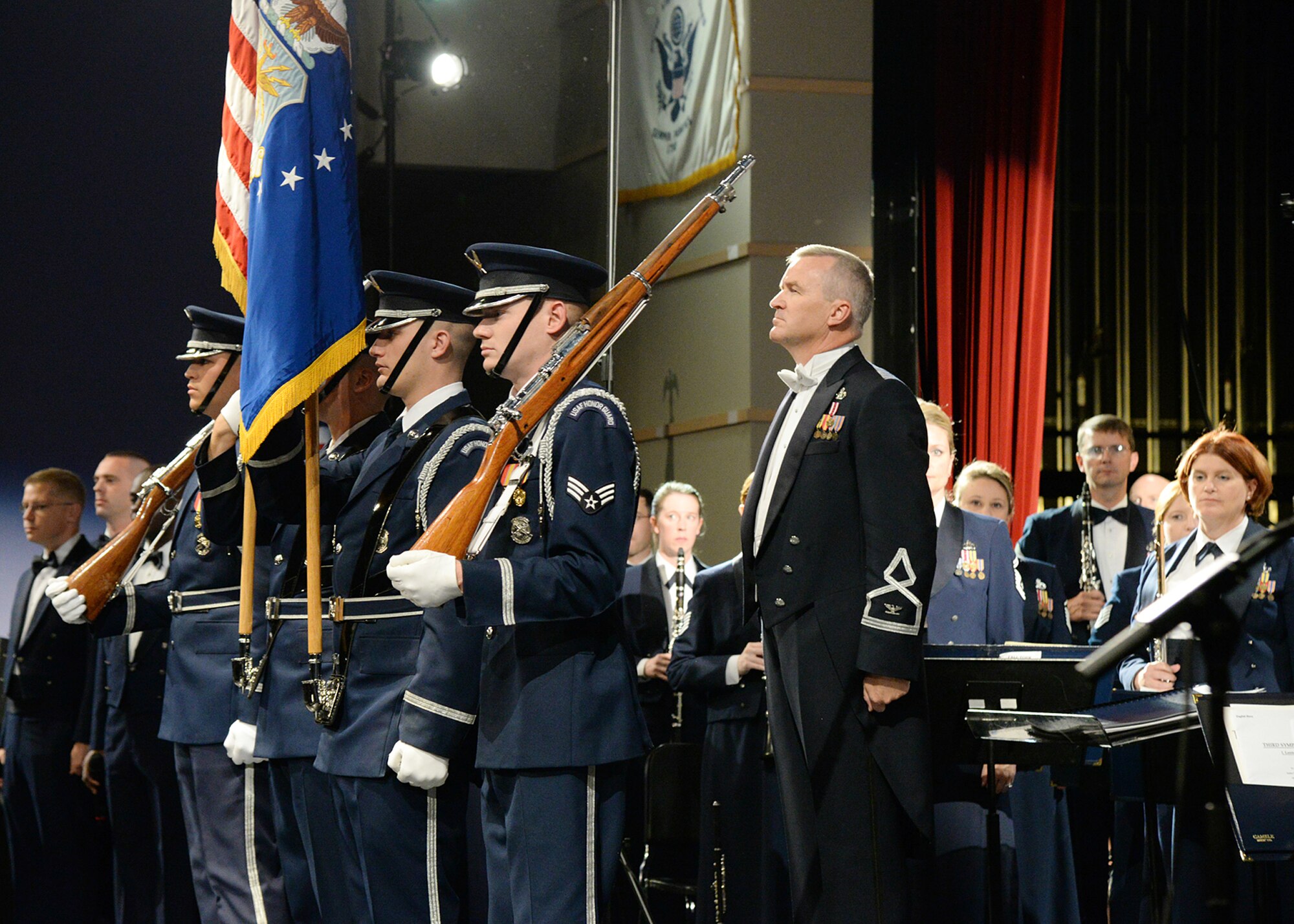 Members of the Honor Guard present the colors prior to a U.S. Air Force Concert Band and Singing Sergeants performance at the Frederick F. Foresteire Center for the Performing Arts, Everett High School, Everett, Mass., Oct. 17. The Concert Band and Singing Sergeants consist of more than 150 active duty Airmen musicians stationed at Joint Base Anacostia-Bolling in Washington, D.C. (U.S. Air Force photo by Linda LaBonte Britt)

.

