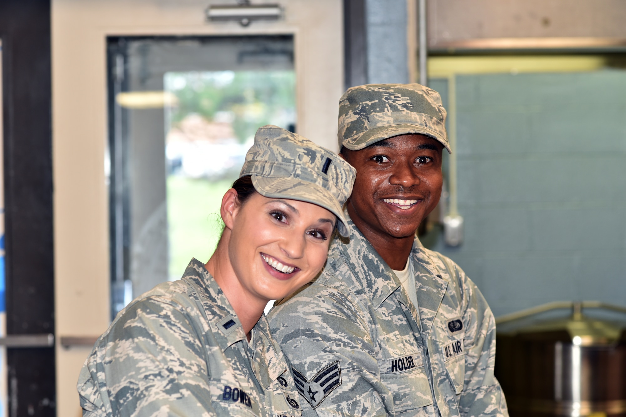 First Lt. Rachel Bowen, left, 175th Services Flight Commander stands with Senior Airman Trevor Holder in the kitchen of Warfield Air National Guard Base's Dining Facility in Baltimore, Md. Bowen is the October Airman Spotlight.(U. S. Air National Guard photo by Senior Master Sgt. Ed Bard/RELEASED)