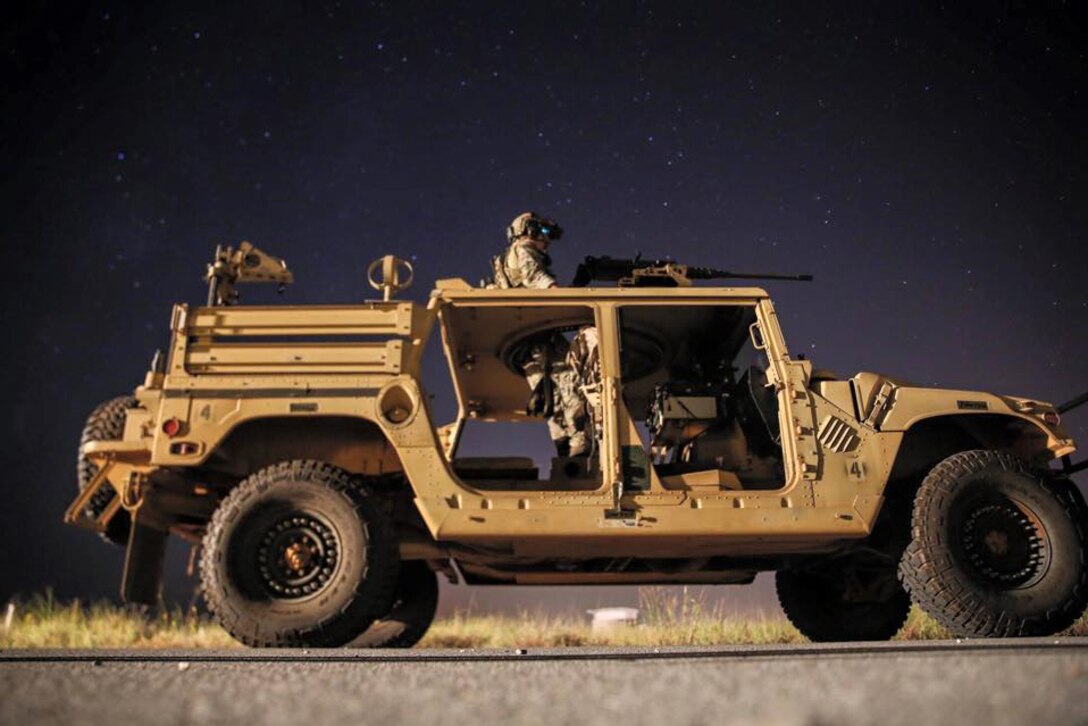 A Green Beret provides security for the team using a Humvee-mounted M2 machine gun during a training exercise on Hurlburt Field, Fla., Oct. 13, 2015. U.S. Army photo by Sgt. Stephen Cline

