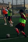 Members from the U.S. and Republic of Korea air forces participate in a soccer game during the Korean and American Friendship Day at Kunsan Air Base, Republic of Korea, Oct. 23, 2015. They participated in activities throughout the day to celebrate and strengthen the partnership shared by the ROK and U.S. (U.S. Air Force photo by Senior Airman Ashley L. Gardner/Released) 