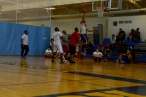 Members from the U.S. and Republic of Korea air forces participate in a three on three basketball game during the Korean and American Friendship Day at Kunsan Air Base, Republic of Korea, Oct. 23, 2015. They participated in activities throughout the day to celebrate and strengthen the partnership shared by the ROK and U.S. (U.S. Air Force photo by Senior Airman Ashley L. Gardner/Released) 