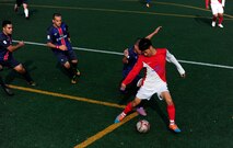 Members from the U.S. and Republic of Korea air forces play soccer during the Korean and American Friendship Day at Kunsan Air Base, Republic of Korea, Oct. 23, 2015. They participated in activities throughout the day to celebrate and strengthen the partnership shared by the ROK and U.S. (U.S. Air Force photo by Staff Sgt. Nick Wilson/Released)