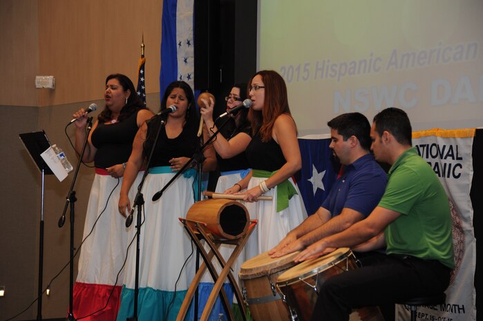 DAHLGREN, Va. - Semilla Cultural (Cultural Seed) performers - Tilia Flores-Rivera, Eunice Mercado, Jennilee Padilla, Isha Renta, Raul Zapata, and Jose Polo-Morales - sing "Campo" and "Yo Cantaré" in a medley followed by "Adiós mis Ojitos" and "Luis Canté" at the Naval Surface Warfare Center Dahlgren Division (NSWCDD) sponsored Hispanic Heritage Observance Oct. 7. 